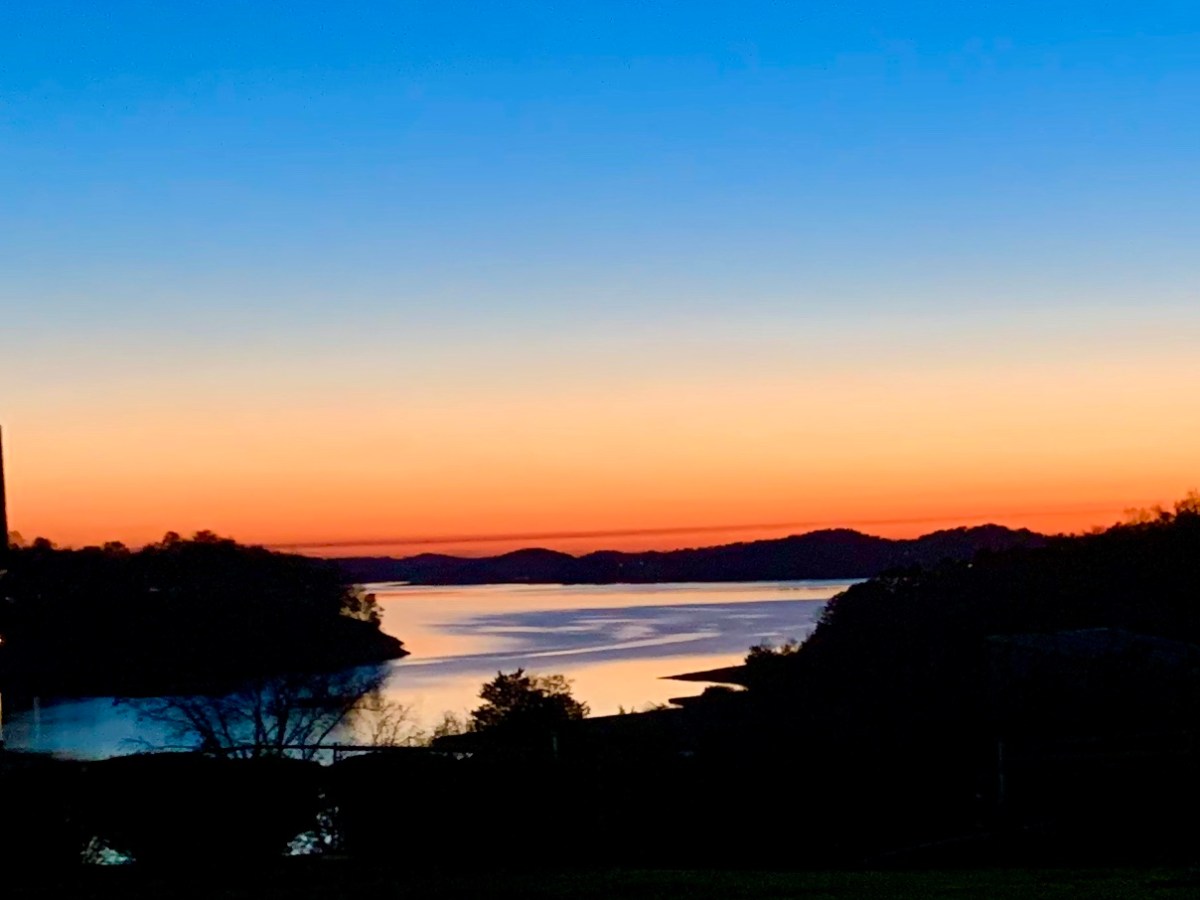 a sunset over a body of water