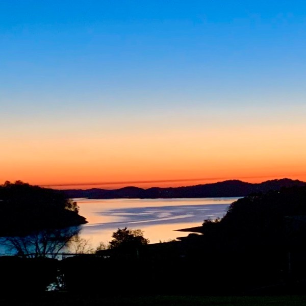 a sunset over a body of water