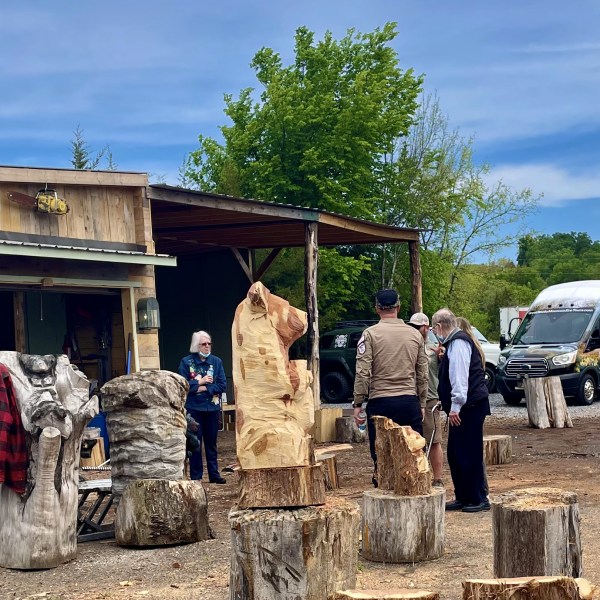 a group of people standing in front of a truck
