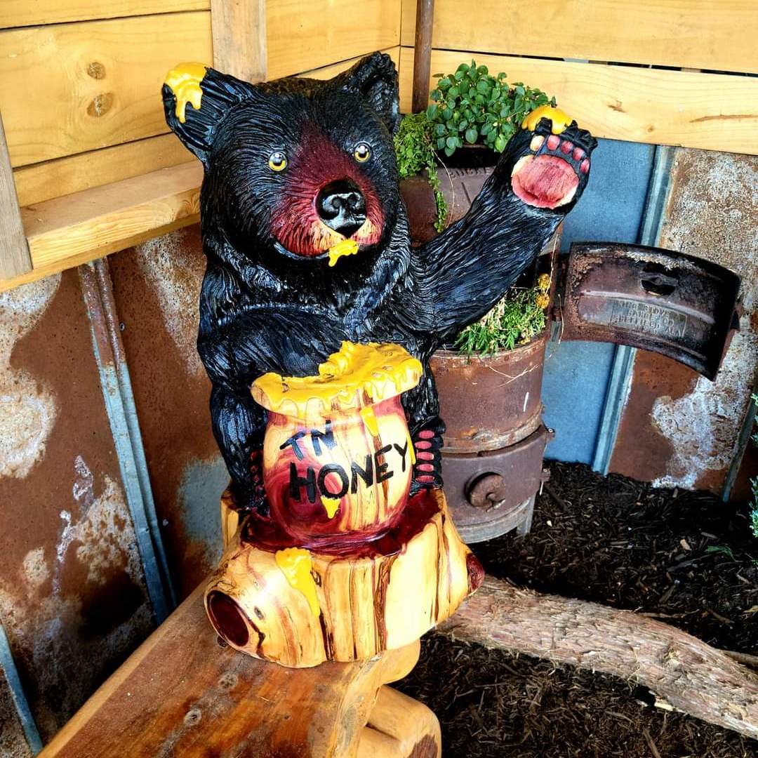 a wooden bear statue