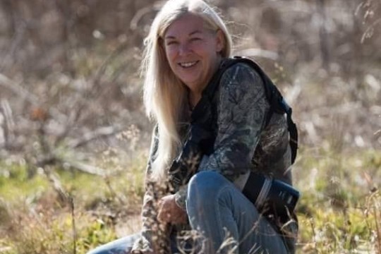 a person sitting in a forest